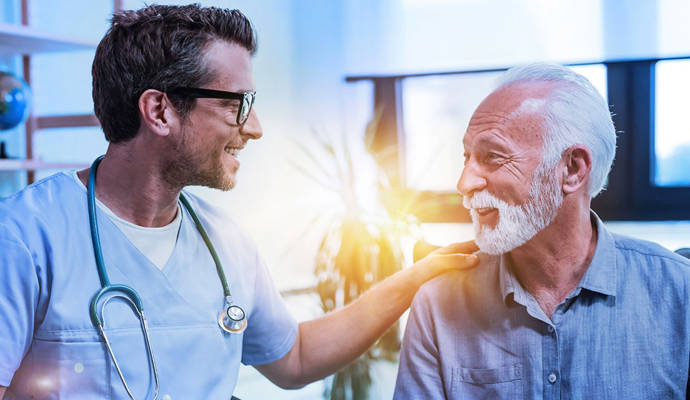 Positive clinician engaging with male patient