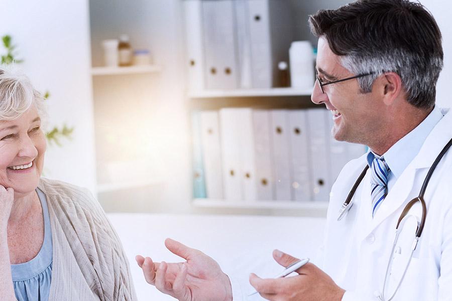 Friendly clinician engaging with a female patient