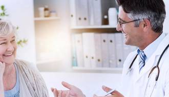 Friendly clinician engaging with a female patient