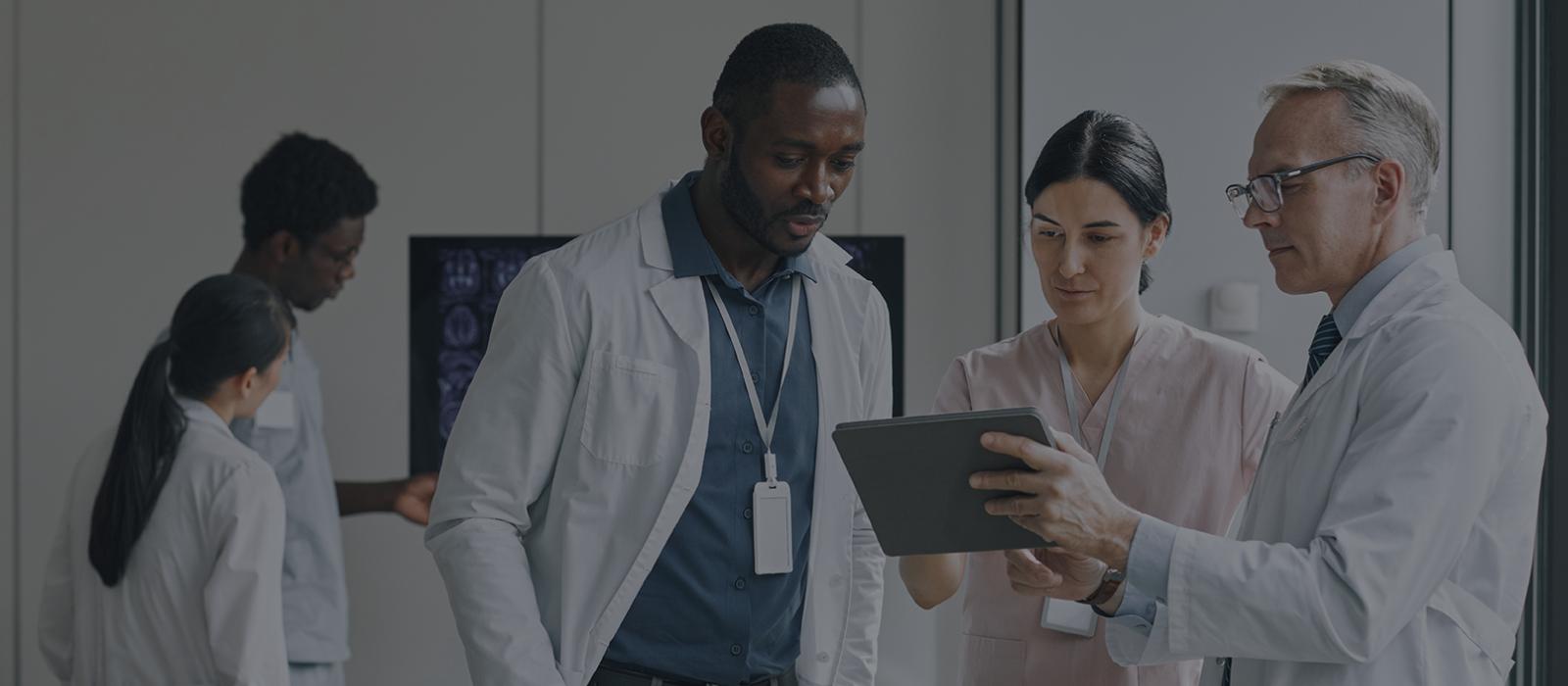 Healthcare professionals reviewing scans