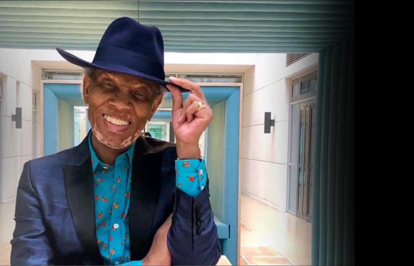 Older male patient wearing a hat and suit