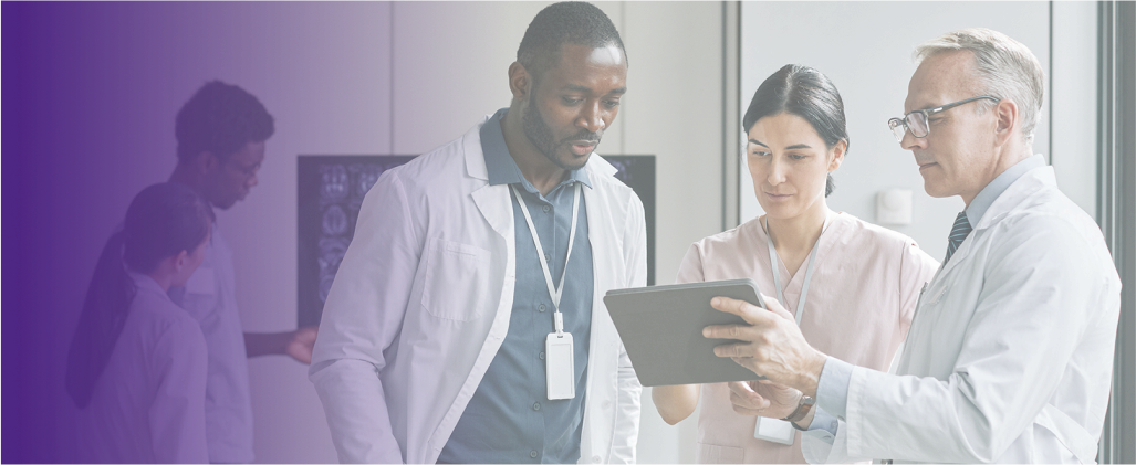 Clinicians looking at medical results on a tablet